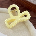 Detailed macro view of yellow bow hair claw clip with golden metal spring mechanism - Yellow Bow Style 2
