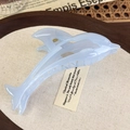 Detail of a pearlescent light blue dolphin hair claw clip with a durable gold metal spring - Blue Dolphin (26822F)