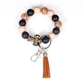 Silicone bead keychain bracelet featuring leopard print cross and brown tassel - Leopard Caramel / Caramel color