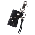 Detail of vintage black leather lighter case keychain with metal rings and tassel - Black