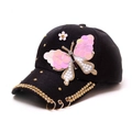 Berretto nero con farfalla di paillettes rosa, strass e anelli di metallo oro - Taglia unica / Nero