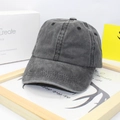 Close-up of dark grey washed cotton baseball cap with six-panel design and ventilation holes - Dark Gray