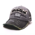 Detailed view of the 1969 patch embroidery and distressed fabric on a baseball cap - One Size / Black and Gray