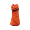 Detail of rollable orange straw hat showing woven texture and bow with elastic strap - One Size / Orange