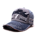Close-up of Black Rebel 3D embroidery on washed denim baseball cap with distressed edges - One Size / Navy Blue Brim