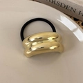 Detailed close-up of golden geometric metal clasp on black elastic hair tie for women - Gold Double Arch (25763C)