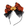 Dettaglio fascia per Halloween con fiocco arancione a ragnatela e zucca glitterata - Stile Fascia