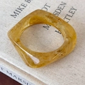 Macro shot of an amber resin ring with a square geometric shape and marble texture - Yellow Square Style (25835B)