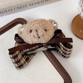 Close-up of cute plush teddy bear hair clip with brown ribbon and houndstooth pattern bow - Duckbill Clip (25845A) / Brown