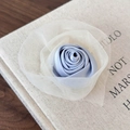Detail of blue satin rose hair clip with cream mesh petals on a vintage book background - Mesh Decoration Hair Clip / Blue