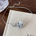 Detail view of a matte rose pendant and polished bead on a silver snake chain choker - Silver Flower
