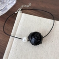 Close-up of leather rose and pearl choker necklace with an adjustable metal chain extender - Black Flower