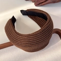 Close-up of a wide knitted headband in dark brown with detailed weaving texture - Coffee (26139C)