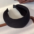 Close-up of a wide black knitted headband featuring exquisite mesh texture and side view - Black (26139D)