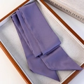 Close-up of elegant purple satin silk scarf folded in a wooden tray with a book - Purple (26183C)
