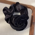 Macro detail of elegant black velvet rose scrunchie with soft sheen on wooden tray - Black Rose Style (26274H) / Black