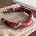 Red plaid headband with gold metal handmade logo for women over a soft beige background - Light Plaid (26430A)