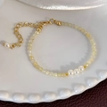 Detail of yellow crystal beaded bracelet with white pearls and gold lobster clasp - Beige Beads (25227A)
