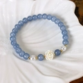 Detailed view of blue crystal beads with white camellia and pearls in a ceramic tray - 6mm Bead Diameter / Camellia Decoration Style (25384A)