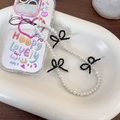 Phone case with white pearl strap, black bead bows and colorful artistic graffiti art - Black Bowknot (25415B)