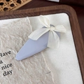 Detail of lavender ballet bow hair clip with cream ribbon on rustic wooden background - Blue
