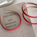 Elegant red satin thin headband for women on a beige book with a minimalist vintage design - Red