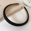 Detailed view of black woven straw headband with non-slip beige velvet lining texture - Black