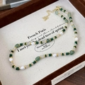 Peacock green stone and baroque pearl beaded necklace with gold accents and clasp - Malachite green