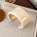 Detailed view of an irregular marbled acrylic cuff bangle with retro cream textures - Milk Tea Wide Edge (25722D)