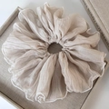 Close-up of beige organza oversized scrunchie with detailed white piped edge finish - Beige (Original Puffy Style)