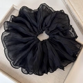 Detailed view of a large black pleated chiffon scrunchie with delicate hemmed edges - Black (Original Puffy Style)