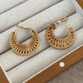 Detail of hand-woven straw hoop earrings with gold metal frame in a wooden jewelry box - Semicircle Horseshoe Style (25780A)