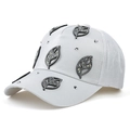 Close-up of white baseball cap featuring sparkling rhinestone leaf patches and silver studs - 55-58cm / White