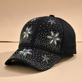 Detailed close-up of colorful floral rhinestones on a black baseball cap with crystal gems - One Size / Black