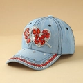 Detailed macro view of denim baseball cap with heart-shaped red rhinestones and silver crystals - Heart Light Blue