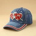 Close-up of denim baseball cap with rhinestone heart patterns and pearl studs - Heart Denim Blue