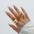 Retro gold alloy ring set with amber acrylic stones and textured hammered surfaces - Gold Ring Set Two