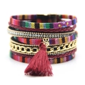 Bohemian multilayer magnetic bracelet with ethnic weave patterns and a deep red tassel - Red