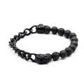Dettaglio di perline in pietra lavica e teschio in metallo su bracciale punk da uomo - Canna di fucile