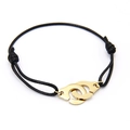 Adjustable black woven bracelet featuring interlocking gold handcuff charms - Gold
