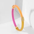 Detail of a three-color resin bracelet featuring an intricate gold floral embossed charm - Golden Yellow Rose Red Mixed