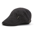 Detail of grey cotton flat cap featuring quilted diamond patterns and metal logo side plate - Dark Gray Quilted Cotton (12#)