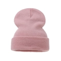 Detailed view of pink ribbed knit beanie with soft elastic texture and folded cuff - Adult / Pink