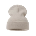 Close-up of oatmeal knit beanie showing ribbed texture and folded cuff design - Adult / Beige