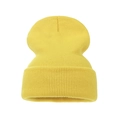 Close-up detail of the bright yellow thick knit texture and folded cuff of the warm beanie - Adult / Light Yellow