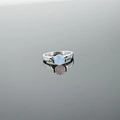 Minimalist silver steel ring featuring a round light blue opal stone on a reflective base - US 4 / Blue Opal Ring