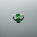 Elegant vintage silver ring featuring an oval green gemstone with white diamond accents - US 5 / Green Gemstone