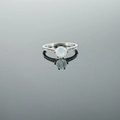 Minimalist silver steel ring with opal stone and sparkling side stones on a mirror base - US 4 / White Opal Ring