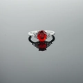 Vintage silver ring featuring a large oval red gemstone and accent zircons - US 5 / Red Stone