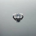 Silver S925 ring featuring an oval transparent gemstone and small side diamonds - White Stone